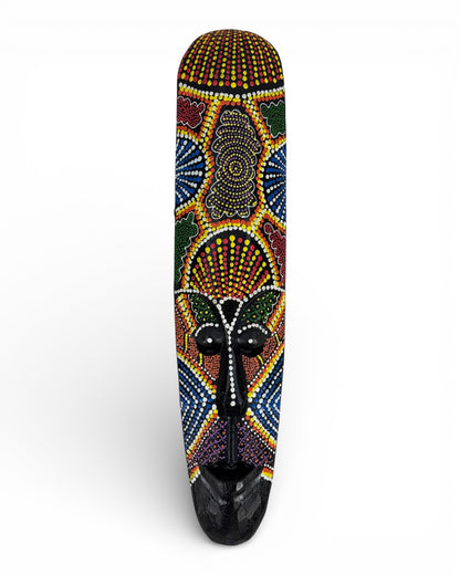 Unique piece: Handmade teakwood mask with a colorful polka dot pattern